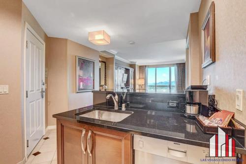 a kitchen with a sink and a counter top at MGM Signature-28-814 1Br 2Ba F1 Pits View Balcony in Las Vegas