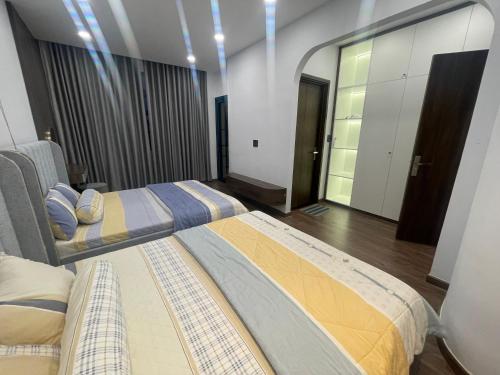 a room with two beds in a room at Holiday Villa Novaworld Phan Thiet in Phan Thiet