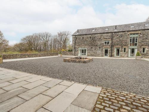 an empty courtyard in front of a brick building at Oak Cottage in Ulverston