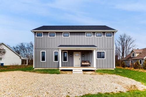 a large gray house with a garage at Sawyer Serenity in Sawyer