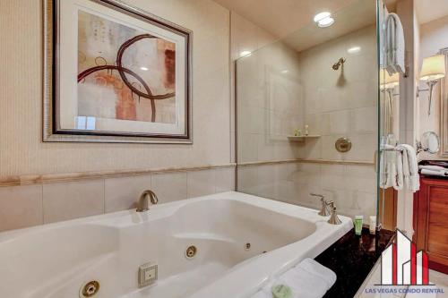 a large white bath tub in a bathroom at MGM Signature-34-803 F1 Track & Strip View Studio in Las Vegas