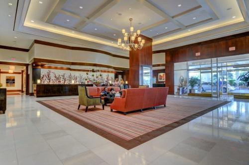 a lobby of a hotel with chairs and a table at MGM Signature-34-803 F1 Track & Strip View Studio in Las Vegas