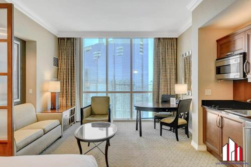 a living room with a kitchen and a dining room at MGM Signature-34-819 F1 Track & Strip View Studio in Las Vegas