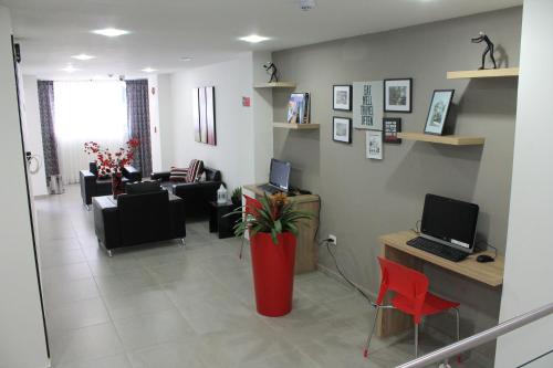 TV a/nebo společenská místnost v ubytování Hotel Guadalupe Plaza