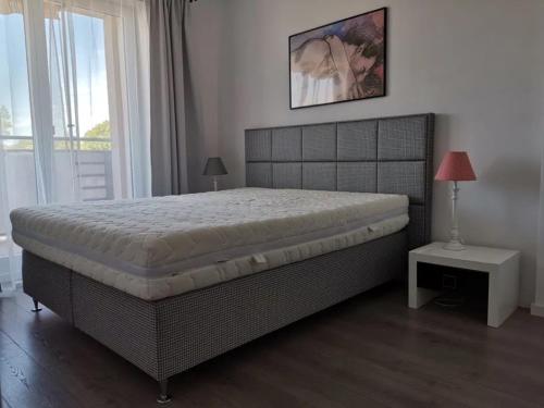 Ένα ή περισσότερα κρεβάτια σε δωμάτιο στο Willa Park Dziwnow