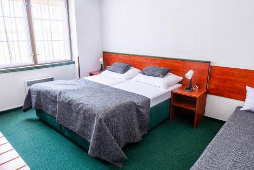 Voodi või voodid majutusasutuse Motel Arkus toas