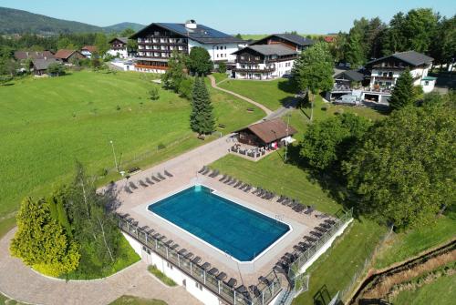 an aerial view of a house with a swimming pool at Hotel Lohninger-Schober in Sankt Georgen im Attergau