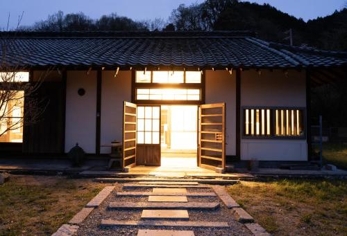 a small house with a door and a window at しまなみ宿Gyoku in Imabari