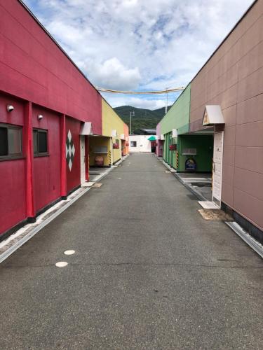 a row of colorful buildings on a street at 夢街道53 in Okayama