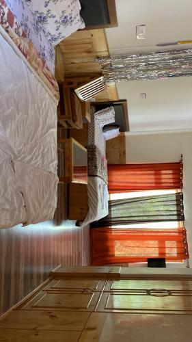 a bedroom with two bunk beds and a window at Jimmys homestay in Leh