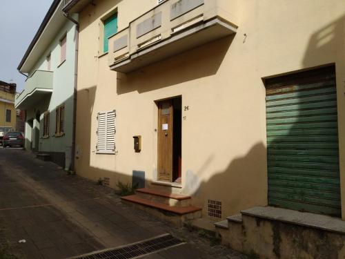 a white building with a door and a door sidx sidx at CasaFigus La Terrazza NARBOLIA in Narbolia