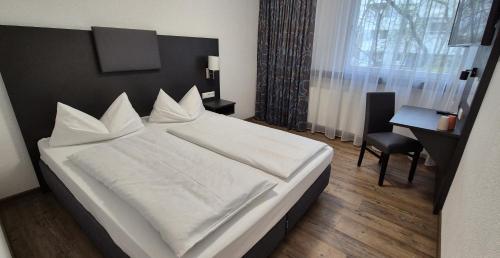 Melvi Hotel Göppingenにあるベッド