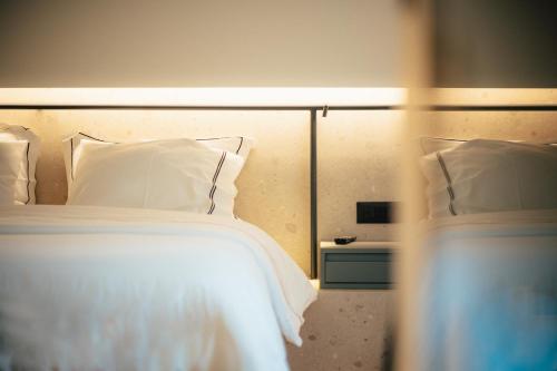 Ένα ή περισσότερα κρεβάτια σε δωμάτιο στο Amario Suites Hotel