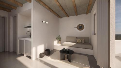 een kleine slaapkamer met een bed en een tafel bij Seascape, apartment 5 with sea view in Áno Meriá
