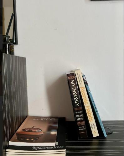 two books stacked on top of each other on a desk at H&H at Grace Residences in Manila