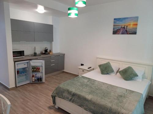 En eller flere senge i et værelse på Sunrise MV 15