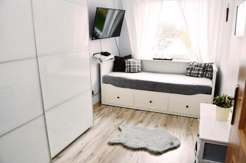 Apartament Morska Bryza tesisinde bir odada yatak veya yataklar