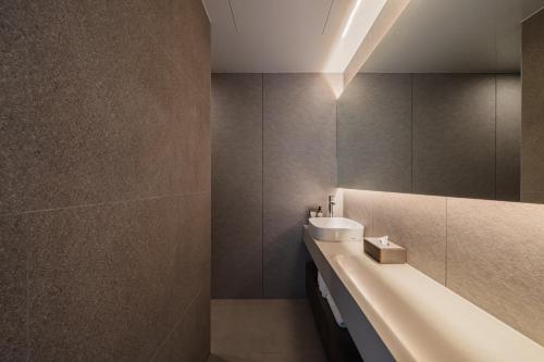 a bathroom with a sink and a mirror at Luxury hanok with private bathtub - SW13 in Seoul