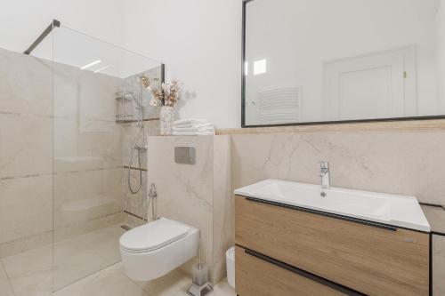 a bathroom with a toilet and a sink and a shower at UNIQUE EXPERIENCE at Rimanóczy Palace Oradea in Oradea