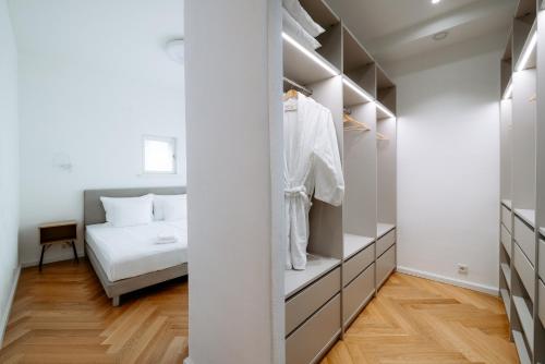 a bedroom with a bed and a closet at Hestia Hotel Barons Old Town in Tallinn