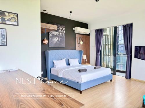 a bedroom with a blue bed in a room at Cube 8teens by Nest Home in Johor Bahru