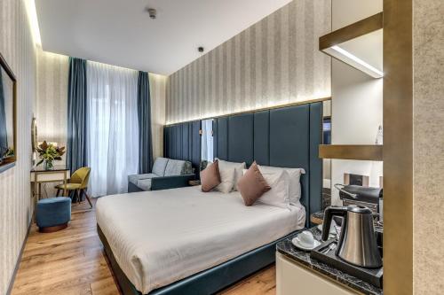 Postel nebo postele na pokoji v ubytování CC Palace Hotel