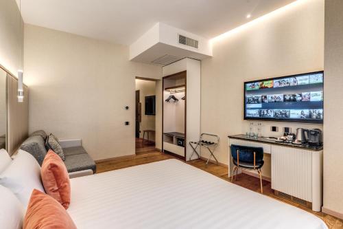 a hotel room with a bed and a desk at CC Palace Hotel in Rome