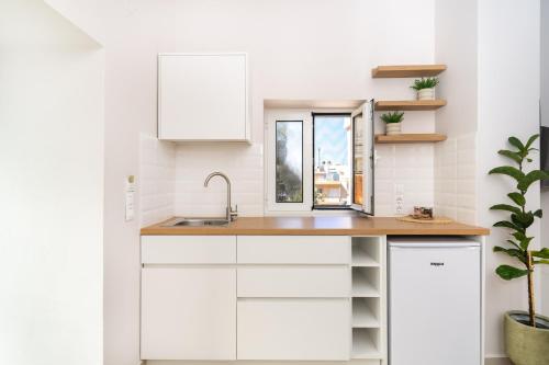 Η κουζίνα ή μικρή κουζίνα στο Camara Residence