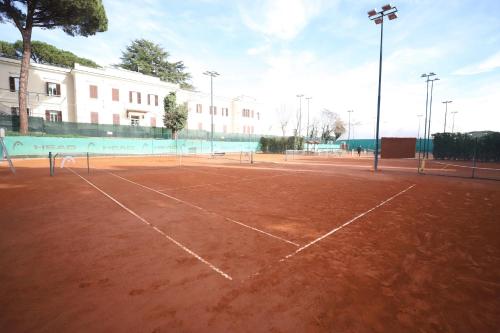 a tennis court with a net on top of it at LH Hotel Excel Roma Montemario in Rome