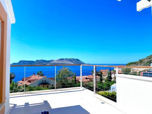 a view of the ocean from the balcony of a house at Akdeniz Villa in Kas