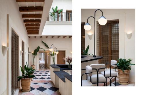 a kitchen and a dining room with plants at Casa del Rey Sabio in Seville
