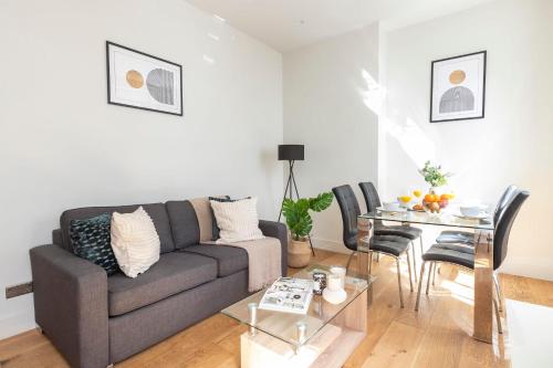 a living room with a couch and a table at Central London Soho Suite - CityApartmentStay in London