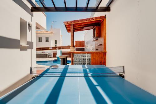 a villa with a pool in the middle of a house at Seafront Protaras Villas in Protaras