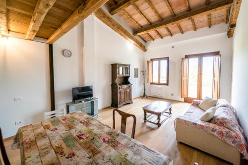 a living room with a couch and a table at Agriturismo Bio San Mamiliano in Grosseto