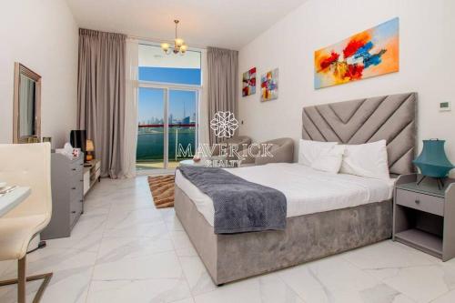 a bedroom with a large bed and a large window at Gorgeous Burj Khalifa+CanalView in Dubai