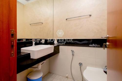 a bathroom with a sink and a toilet at Gorgeous Burj Khalifa+CanalView in Dubai