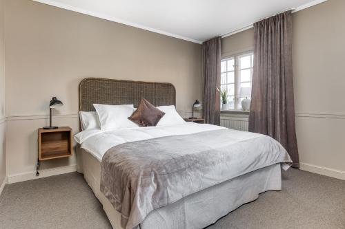 Säng eller sängar i ett rum på Brunnsvik Hotell & Konferens