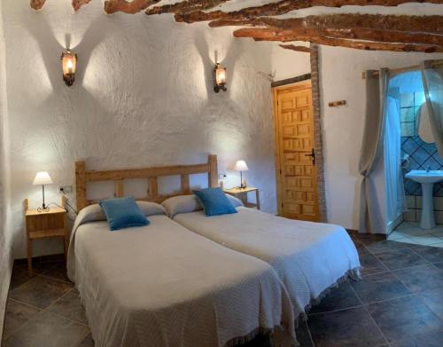 Säng eller sängar i ett rum på Casa Rural María Y Cristina