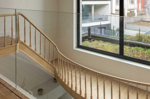 a staircase in a house with a window at Spacious Belle Epoque House with free parking in Ostend
