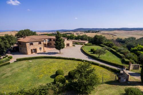 an aerial view of a house in a field at Villa Asciano 20 by Mmega in Trequanda