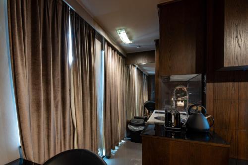 a hallway with drapes in a hotel room at Luxury Studio Flat Victoria SW1 in London