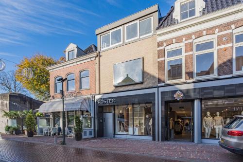 a store on a street in front of a building at Molenzicht in Alkmaar