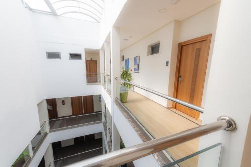 a hallway with stairs in a building with a skylight at Olympic Inn Casablanca in Casablanca