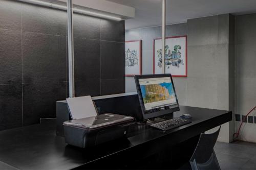 Телевизор и/или развлекательный центр в City Express by Marriott Ciudad de México Alameda