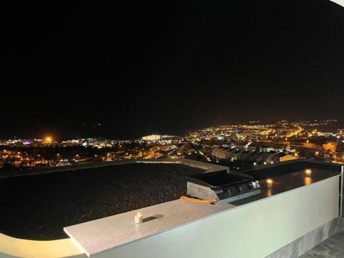 a view of a city at night from a rooftop at Vila Ocean View Tenerife in Adeje