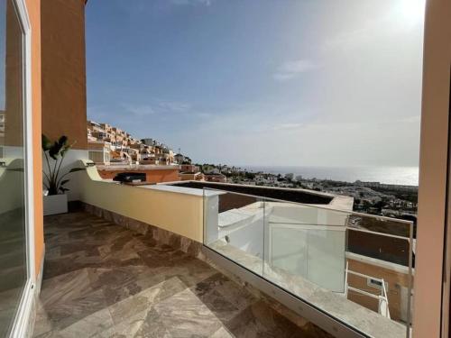 a balcony with a view of the ocean at Vila Ocean View Tenerife in Adeje