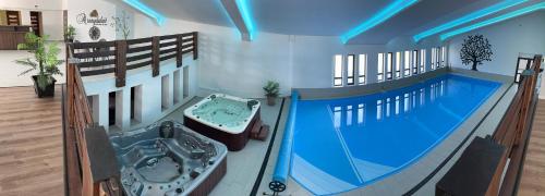 an overhead view of a swimming pool in a house at Aranydukát Vendégház Tállya in Tállya