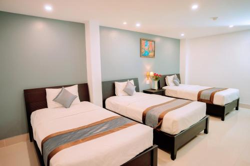 Ένα ή περισσότερα κρεβάτια σε δωμάτιο στο Song Tien Hotel