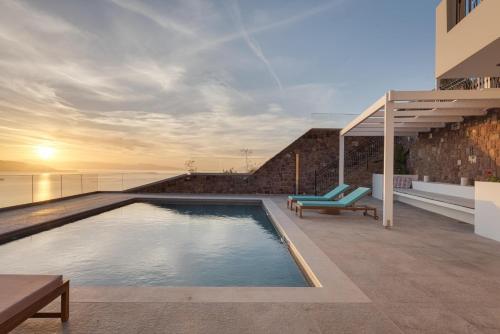 a swimming pool on the roof of a house at Kaerati Villa Aegina in Aegina Town