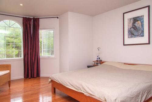 a bedroom with a bed and a window at Villa Sitges Mas Mestre in Olivella